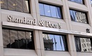 S&P: Обесценение тенге ограничит развитие банковского сектора РК 